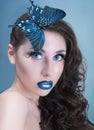 Studio beauty portrait with blue butterfly