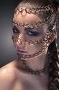 Studio beauty portrait in chains