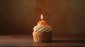 Studio capture of a delectable caramel cupcake topped with a single candle generative ai