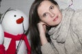 Humeral portrait of the girl with a snowman Royalty Free Stock Photo