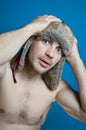 Studio closeup colorful portrait of face young glamour sportive hipster man in stylish fur hat with crazy emotions surprise