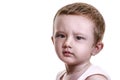 Studio closeup portrait of little baby boy with serious face loo Royalty Free Stock Photo