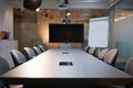 Studio conference room with a minimalist layout in an empty office suite setting Royalty Free Stock Photo