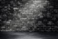 Studio dark room black brick wall grunge texture background with light shading.