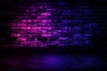 Studio dark room with lighting effect red and blue on brick wall gradient background for interior decoration. Royalty Free Stock Photo