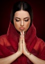 Studio, face, closed eyes, red shawl, drawing mehendi, prayer, r Royalty Free Stock Photo