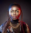 Studio fashion portrait of young African ethnicity woman with shiny make up