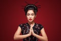 Studio fashion shot of Asian woman in black kimono