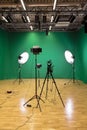 Studio for filming on a green background. The chroma key. Lighting equipment in the Studio. Green screen Royalty Free Stock Photo