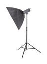 Studio flash with soft-box, isolated on a white background. Photo studio equipment. Black stripsoft box. Royalty Free Stock Photo