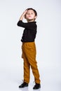 Studio full-length portrait of a boy doing a nice pose, casual dress