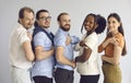 Studio group portrait of happy diverse people showing arms after getting vaccine