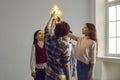 Studio group shot of children standing in circle and holding glowing light bulbs Royalty Free Stock Photo