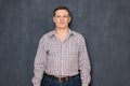 Portrait of happy friendly confident man wearing checkered shirt