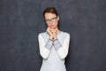 Portrait of serious pensive young woman with glasses Royalty Free Stock Photo