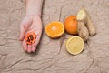 Set of tangerines, lemon, ginger and in his hand a lot of pills. Royalty Free Stock Photo