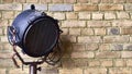 Studio lamp against the background of a brick wall. color Royalty Free Stock Photo