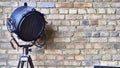 Studio lamp against the background of a brick wall. color Royalty Free Stock Photo