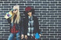 Studio lifestyle portrait of two best friends hipster girls going crazy and having great time together. Isolated on Royalty Free Stock Photo