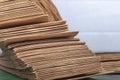 Studio lighting. Close-up side view of a huge stack of recycled paper. A huge stack of envelopes of recycled paper. Close-up