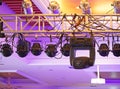 Studio lighting equipment high above an outdoor theatrical performance