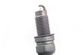 Studio lighting. spark plug from a gasoline engine. It is matte. Close-up