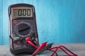 Studio lighting. wooden background in retro style with stained glass painting. Voltmeter. Close-up