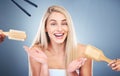 Studio makeover, hair and beauty with woman looking happy about hair care by professional people against a grey Royalty Free Stock Photo