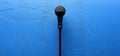 Studio microphone on blue wall. Podcast backdrop Royalty Free Stock Photo