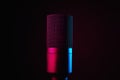 Studio microphone on dark background with neon lights Royalty Free Stock Photo