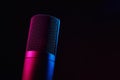 Studio microphone on dark background with neon lights Royalty Free Stock Photo