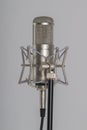 Studio microphone on a grey background. Condenser Royalty Free Stock Photo