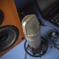 Studio microphone, headphones, speakers and computer. Home studio recording for sound mixing, sound design and music Royalty Free Stock Photo