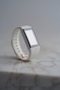 Mockup of a white fitness tracker with blank screen and unmarked bezel Royalty Free Stock Photo