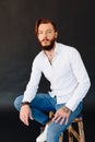 Studio photo of a beautiful young man with a beard Royalty Free Stock Photo