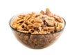 Studio photo of bowl with heap of peeled walnuts isolated on white