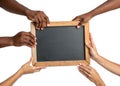 Multiple hands holding blank chalkboard against white background Royalty Free Stock Photo