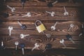 Studio photo of a lock with a broken key in it on a wooden background. Lots of other new keys around the lock Royalty Free Stock Photo