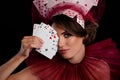 Studio photo stunning woman dealer hold cards near face close eye wear masquerade costume casino night game