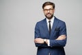 Studio photo of young handsome stylish businessman wearing suit