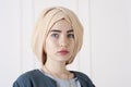 Studio photo of a young woman eastern type in the modern Muslim clothes and beautiful headdress