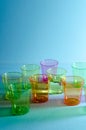 A Studio Photograph of Multicoloured Plastic `Shot` Containers