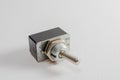 A Studio Photograph of an Old Metal Toggle Switch