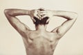 Studio photography of naked back of young man