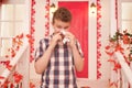 Studio picture from a young man with handkerchief. Sick guy has runny nose. man makes a cure for the common cold Royalty Free Stock Photo