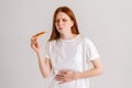 Studio portrait of afflicted sick young woman closed eyes feeling pain in stomach after eating pizza, suffering abdomen Royalty Free Stock Photo