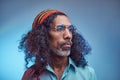 Studio portrait of African Rastafarian male wearing a blue shirt and beanie. Royalty Free Stock Photo