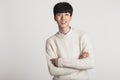 A studio portrait of an Asian young man looking for a camera with confident smiles Royalty Free Stock Photo