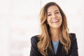 Portrait of beautiful mid aged woman with blond hair wearing blazer and cheerful smiling against at isolated background Royalty Free Stock Photo