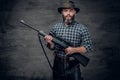 A hunter holds a rifle. Royalty Free Stock Photo